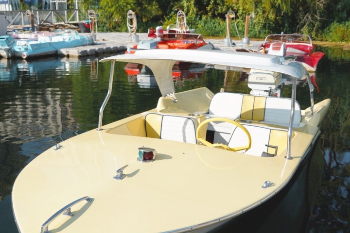 a boat is docked next to a body of water